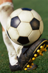 Soccer Player's Leg and Soccer Ball